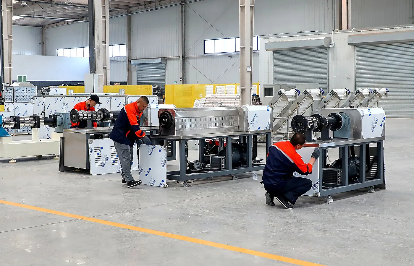 ZEKO technicians assembling and checking food processing machinery